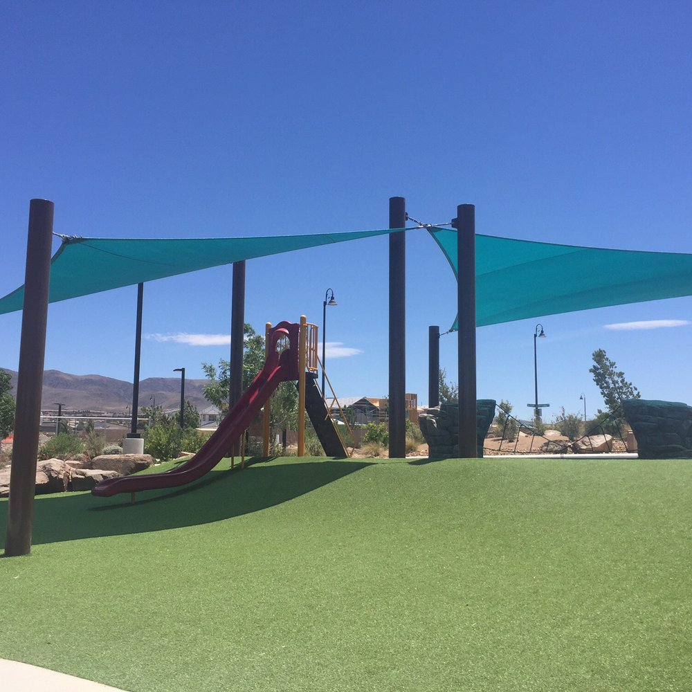 The tall red slide and climbing area