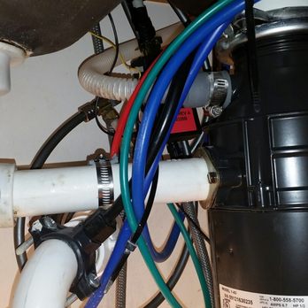 Harvey Baker Plumbing - Looks way too much like heart surgery to me to replace that red labeled unit! - Plumbing Near Me - Orlando, Florida Harvey Baker Plumbing - Looks way too much like heart surgery to me to replace that red labeled unit! - Plumbing Near Me - Orlando, Florida