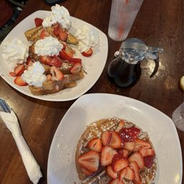 waffles w/ strawberry topping & french toast with whipped cream and strawberries