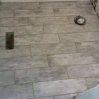 Range Construction - a tile floor in a bathroom - General Contractors Near Me Range Construction - a tile floor in a bathroom - General Contractors Near Me