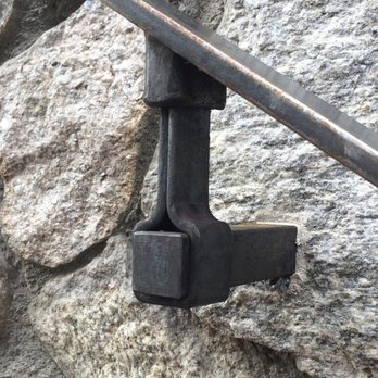 Chris Nast Metalwork - Steel handrail connection into stone - Metal Fabricators Near Me