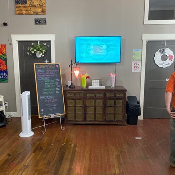 Cherry Street Nutrition - a man standing in front of a tv - Coffee & Tea Near Me - Commerce, Georgia Cherry Street Nutrition - a man standing in front of a tv - Coffee & Tea Near Me - Commerce, Georgia