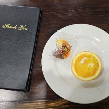 Wasabi 5 - a plate of food and a book - Chinese Near Me - Exton, Pennsylvania