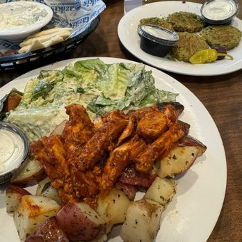 Taziki’s Mediterranean Cafe - Spicy Harissa chicken feast w/ a Caesar salad & roasted potatoes - Greek Near Me - Texarkana, Texas Taziki’s Mediterranean Cafe - Spicy Harissa chicken feast w/ a Caesar salad & roasted potatoes - Greek Near Me - Texarkana, Texas