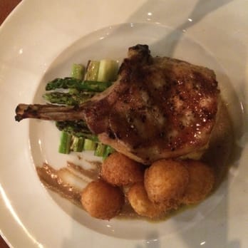 MW Restaurant - Pork chop with asparagus and hush puppies. 4/5 stars. - New American Near Me - Honolulu, Hawaii