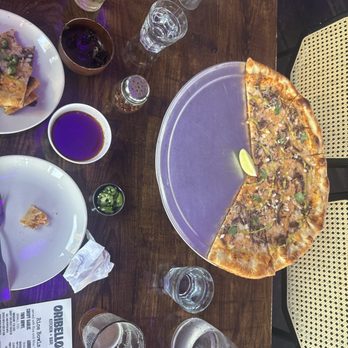Oribello’s Bar & Kitchen - Birria pizza and brussels sprouts - Sports Bars Near Me - Austin, Texas Oribello’s Bar & Kitchen - Birria pizza and brussels sprouts - Sports Bars Near Me - Austin, Texas