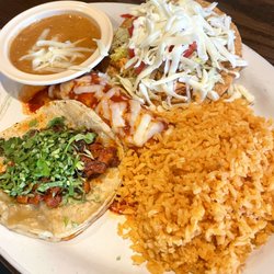 Judy’s Cantina - Al Pastor Tacos with just cilantro, chicken enchiladas and tostadas. Rice and Beans