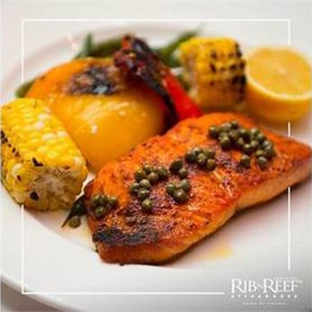 Rib N Reef - grilled salmon with vegetables on a white plate - Steakhouses Near Me - Montreal, Quebec Rib N Reef - grilled salmon with vegetables on a white plate - Steakhouses Near Me - Montreal, Quebec