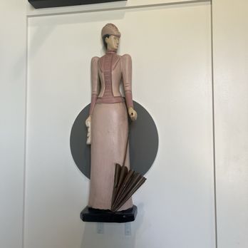 Lara’s Fine Dining - Beautiful wooden figurine on the women's restroom - Italian Near Me - Richmond, California Lara’s Fine Dining - Beautiful wooden figurine on the women's restroom - Italian Near Me - Richmond, California