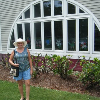 Carver Public Library - Scruffy person in front of library - Libraries Near Me - Carver, Massachusetts