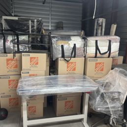 Packed storage unit with wrapped furniture Packed storage unit with wrapped furniture