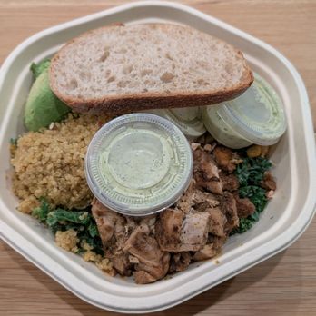 Sweetgreen - Customized Chicken Avocado Ranch with three cups of Green Goddess dressing and a slice of bread (lid off) - Salad Near Me - Long Beach, California