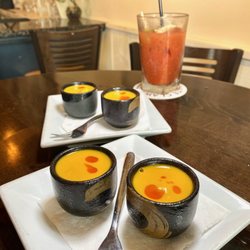 Tempura lobster shooter,lobster bisque, chili oil