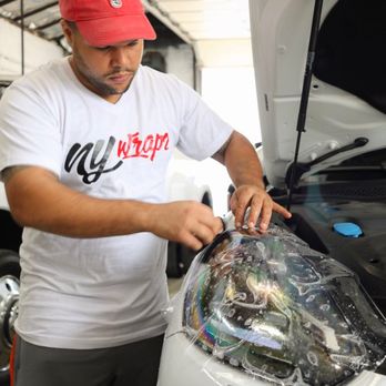 Nywrapz inc - Paint Protection Film being applied to protect the headlights on this Porsche Cayenne from Rock chips and road damage. - Auto Detailing Near Me - Freeport, New York