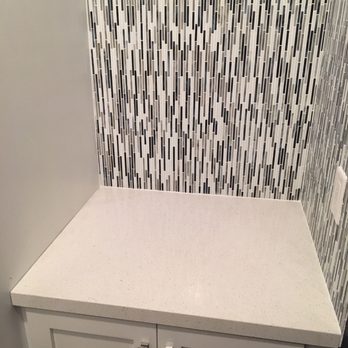 Four Seasons Builders - Waterfall tile gives the room some playfully modern sophistication - General Contractors Near Me - Burbank, California