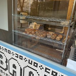 Exterior outside entrance of Starship Bagel - Storefront window with bagels - Dallas, Texas Exterior outside entrance of Starship Bagel - Storefront window with bagels - Dallas, Texas