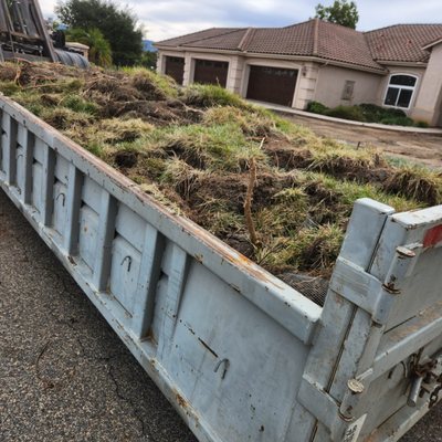 Dumpster Rental - A roll-off dumpster is a type of large, open-top container that is typically used for the temporary storage and disposal of waste materials. It is called a "roll-off" dumpster because it is rolled off of a special truck, which has a cable that slides the dumpster off or a hydraulic arm that lifts the dumpster and places it on the ground.

Roll-off dumpsters come in a variety of sizes and are commonly used by construction and demolition companies, as well as by businesses and individuals for the removal of large amounts of waste.

They are often placed in a convenient location on a job site or at a home or business and typically rented for a specific period of time before being picked up and taken away to be emptied and returned.