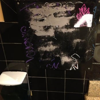 Fuddruckers - Gang graffiti near the men's room paper towels. - Burgers Near Me - Concord, California