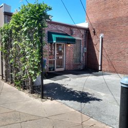 Elsa's Place - Main entry off parking lot facing Railroad Street and back of old Carolina Telephone building.
