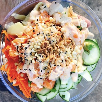 Poke Bros - Spicy Salmon Poke Bowl with Cucumber, Sweet Onions, Green Onions, Tofu, Avocado, and Sriracha Aioli Sauce topped with Sesame Seeds, Tempera - Poke Near Me - Columbia, South Carolina Poke Bros - Spicy Salmon Poke Bowl with Cucumber, Sweet Onions, Green Onions, Tofu, Avocado, and Sriracha Aioli Sauce topped with Sesame Seeds, Tempera - Poke Near Me - Columbia, South Carolina