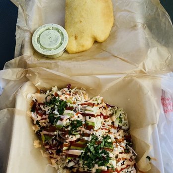 Arepitas - 3 piece Tostones and 1 chicken empanada w garlic sauce on the side. - Venezuelan Near Me - Harker Heights, Texas Arepitas - 3 piece Tostones and 1 chicken empanada w garlic sauce on the side. - Venezuelan Near Me - Harker Heights, Texas