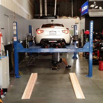 Accurate Alignments and Service - Lowered Scion FR-S used custom built wooden ramps to get on the alignment rack with ease - Auto Repair Near Me - Oceanside, California