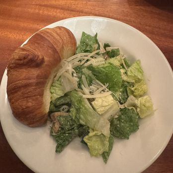 Charleston's - Cesar salad with a honey butter croissant - American Near Me - Oklahoma City, Oklahoma Charleston's - Cesar salad with a honey butter croissant - American Near Me - Oklahoma City, Oklahoma