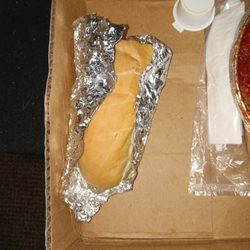 King's New York Restaurant & Pizza - That's how my bread wS wrapped and on the left side u can see saucy fingerprints and no side salad