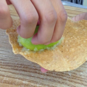 Mariscos San Juan - Rubbing lime on the fried tortillas - Mexican Near Me - San Jose, California Mariscos San Juan - Rubbing lime on the fried tortillas - Mexican Near Me - San Jose, California