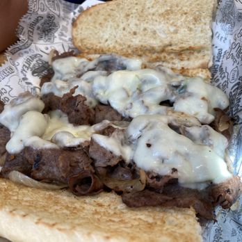 Charleys Cheesesteaks - Large Philly cheesesteak cut in half - Fast Food Near Me - Arvin, California Charleys Cheesesteaks - Large Philly cheesesteak cut in half - Fast Food Near Me - Arvin, California