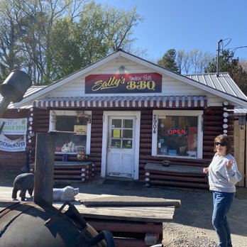 Sally's Smokin Butt BBQ - a woman standing in front of a restaurant - Barbeque Near Me - Fort Payne, Alabama