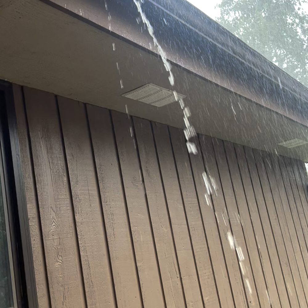 LeafFilter - Water spills out over the guards, especially valley areas. Barely any water makes it to the downspouts. - Gutter Services Near Me - Eden Prairie, Minnesota