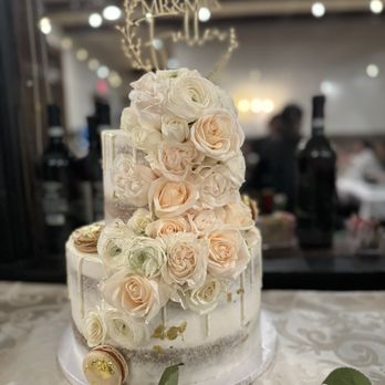 Sweet Revenge Bakery - Our beautiful delicious wedding cake that was decorated with beautiful roses and delicious macaroons - Cupcakes Near Me - San Diego, California Sweet Revenge Bakery - Our beautiful delicious wedding cake that was decorated with beautiful roses and delicious macaroons - Cupcakes Near Me - San Diego, California