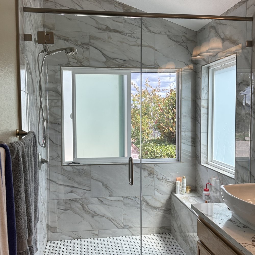Glastec Construction - a bathroom with a glass shower door - General Contractors Near Me Glastec Construction - a bathroom with a glass shower door - General Contractors Near Me