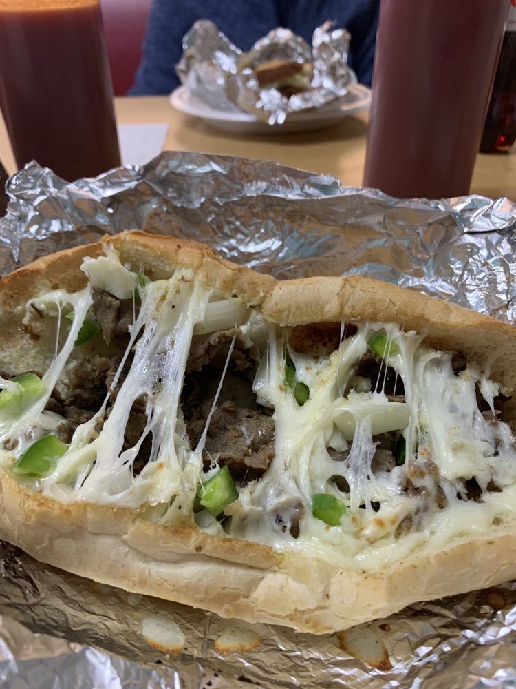 J & E One Stop Oasis Logo