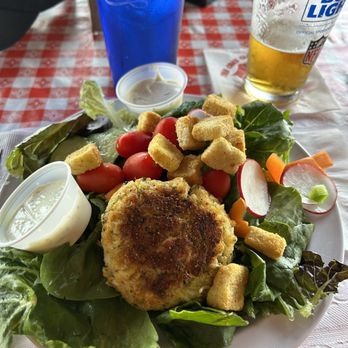 The Crab Claw - Broiled crab cake on garden salad - Seafood Near Me - St. Michaels, Maryland