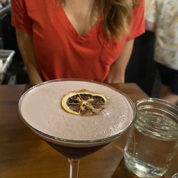 Apothik Eatery + Food Truck - Elderflower & vanilla gin sour with a great background! - Food Trucks Near Me - La Crosse, Wisconsin