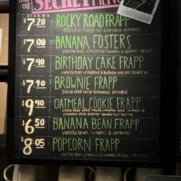 a chalk board with a list of drinks