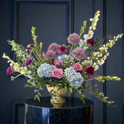 Corporate event florals requested. Only requirements were color scheme and specific budget. We love this moody look of premium blooms!