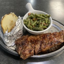The Dive Bar and Grill - Strip steak, baked potato and green beans.