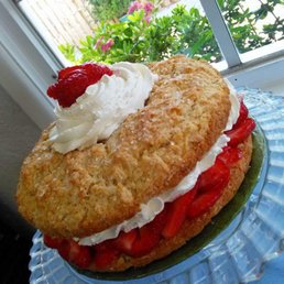 a strawberry shortcake with whipped cream and strawberries