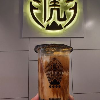 Tiger Sugar - a hand holding a glass of iced tea - Bubble Tea Near Me - Atlanta, Georgia Tiger Sugar - a hand holding a glass of iced tea - Bubble Tea Near Me - Atlanta, Georgia