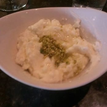Phoenician Taverna - Clotted cream dessert with pistachos - Mediterranean Near Me - Mason, Ohio Phoenician Taverna - Clotted cream dessert with pistachos - Mediterranean Near Me - Mason, Ohio