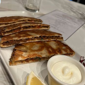 Ammatoli - forgot what this was called but was under the wraps section dinner menu. Came with toum (i think) but get a side of tzatziki as well - Mediterranean Near Me - Long Beach, California