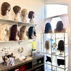 Creative Hair Extensions & Wigs - We carry human and synthetic wigs.