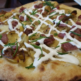 The Boiler Room - Yukon potato, bacon, chive, sour cream on a pizza - Pizza Near Me - Spokane, Washington The Boiler Room - Yukon potato, bacon, chive, sour cream on a pizza - Pizza Near Me - Spokane, Washington