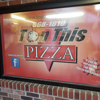 Top This Pizza - a large advertisement on a brick wall - Pizza Near Me - Brewerton, New York