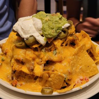 Jimmy Buffett's Margaritaville - Volcano nachos - American Near Me - Orlando, Florida Jimmy Buffett's Margaritaville - Volcano nachos - American Near Me - Orlando, Florida