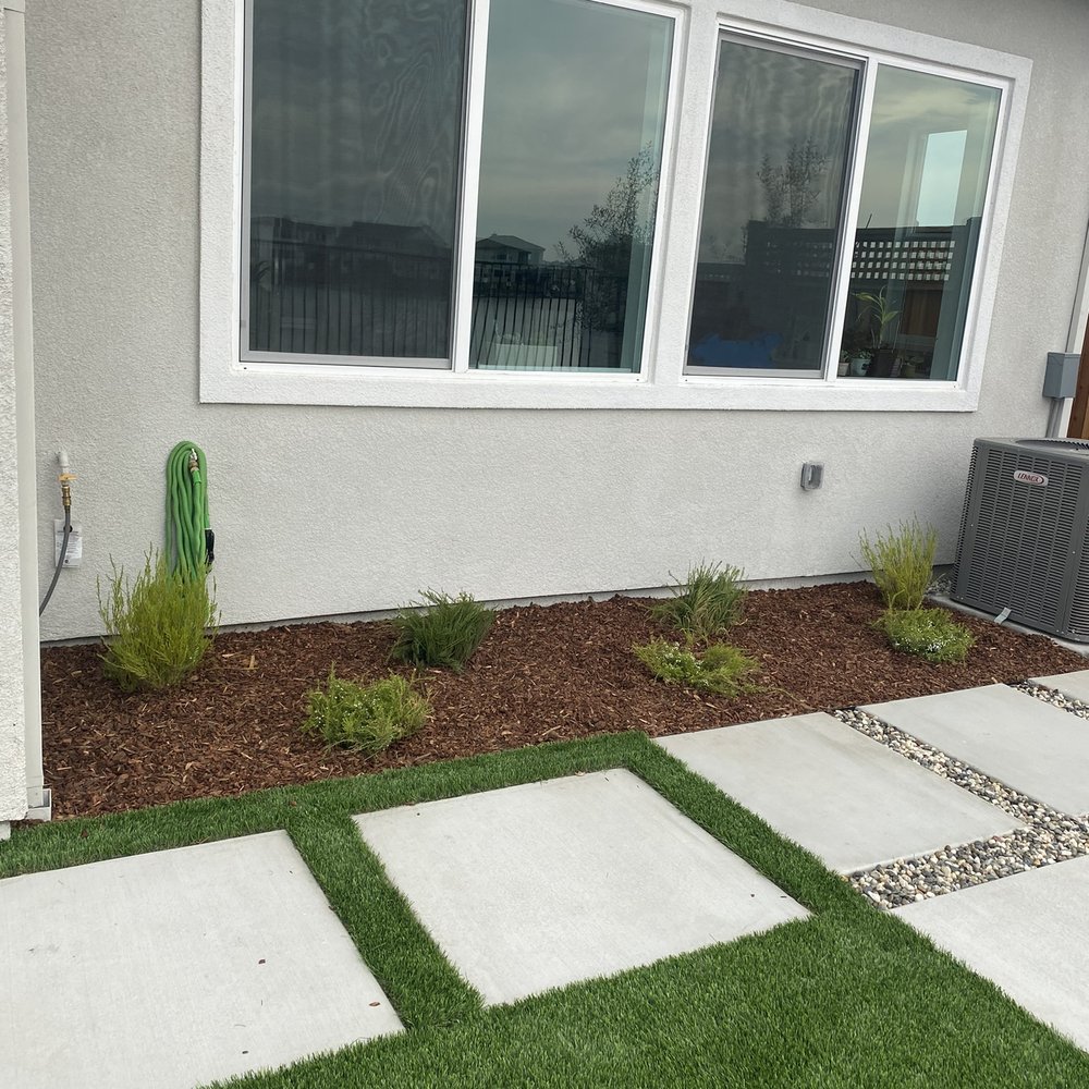 C & J Landscape Service - Square concrete with mixture of grass, gravel, and mulch. - Landscaping Near Me C & J Landscape Service - Square concrete with mixture of grass, gravel, and mulch. - Landscaping Near Me