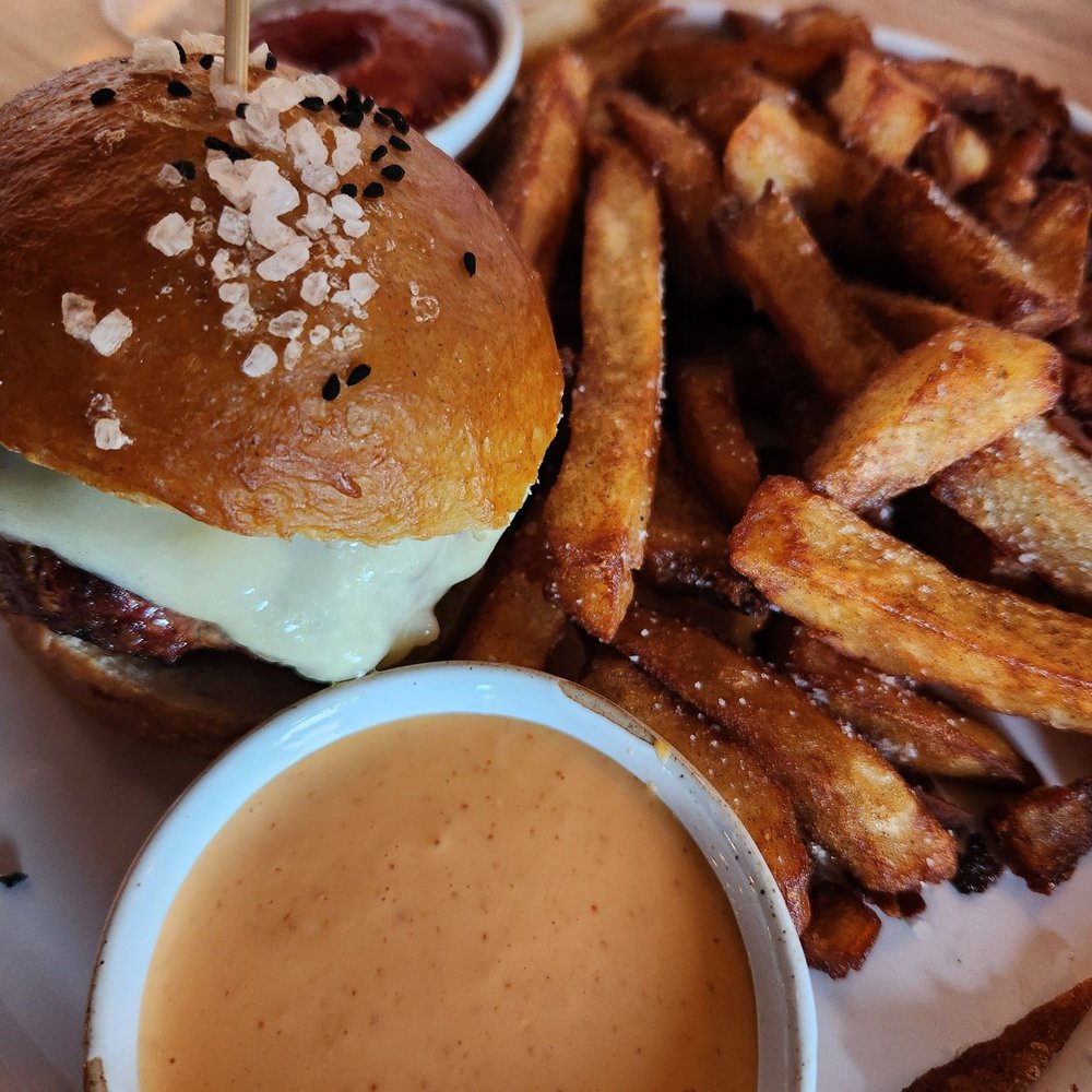 Gunk Haus - a burger and fries on a plate - German Near Me - Highland, New York Gunk Haus - a burger and fries on a plate - German Near Me - Highland, New York